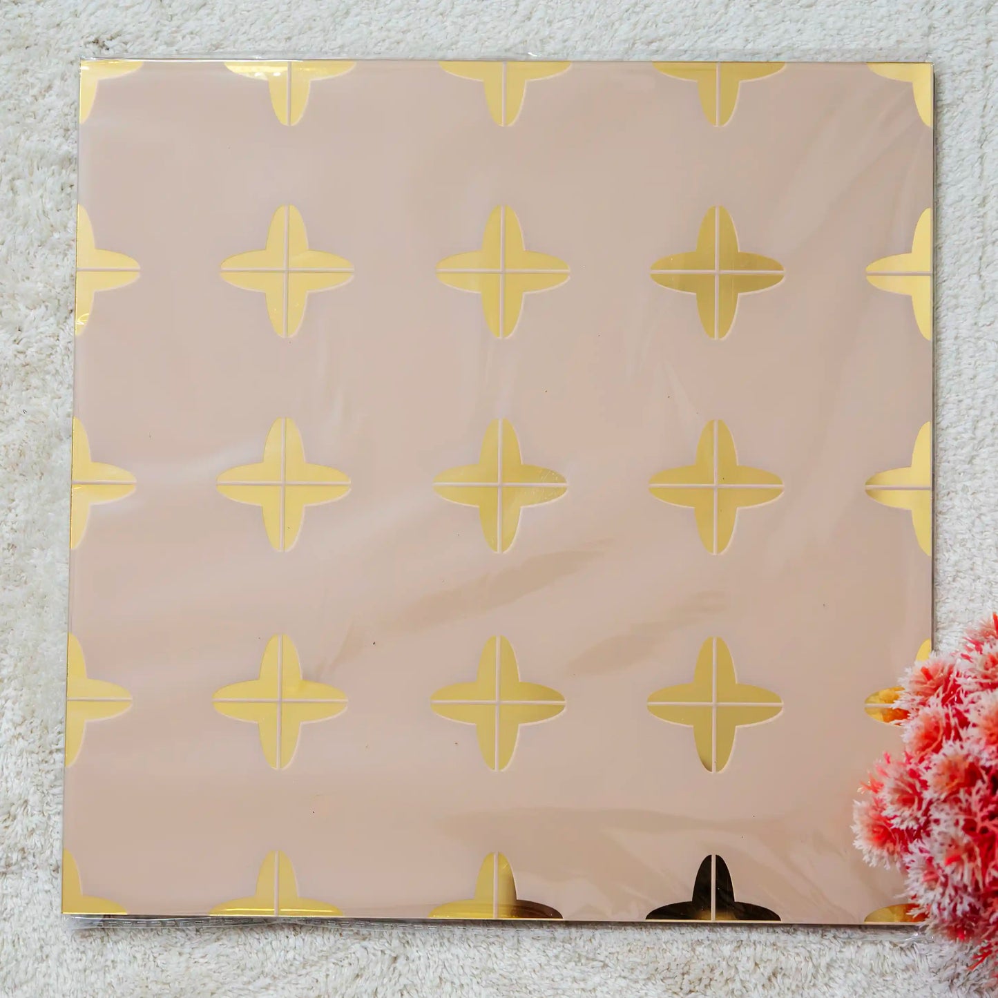 Beige decorative panel with gold star pattern on a textured surface
