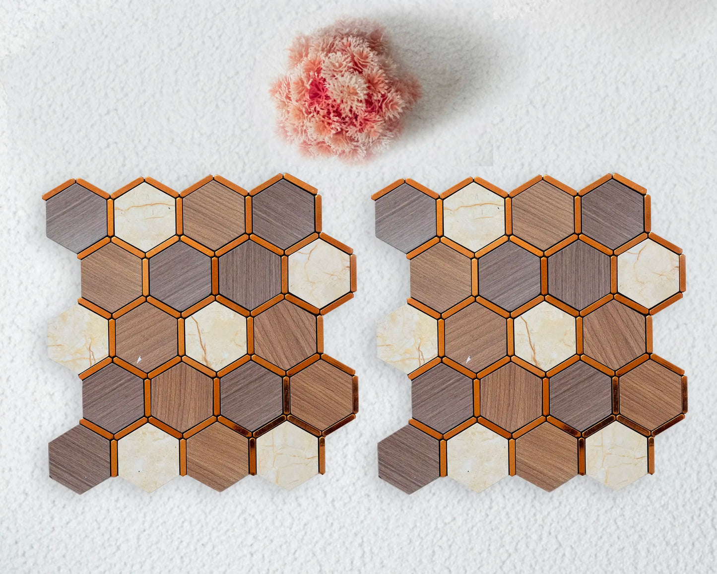 Hexagonal tile samples in various colors on a textured white surface.