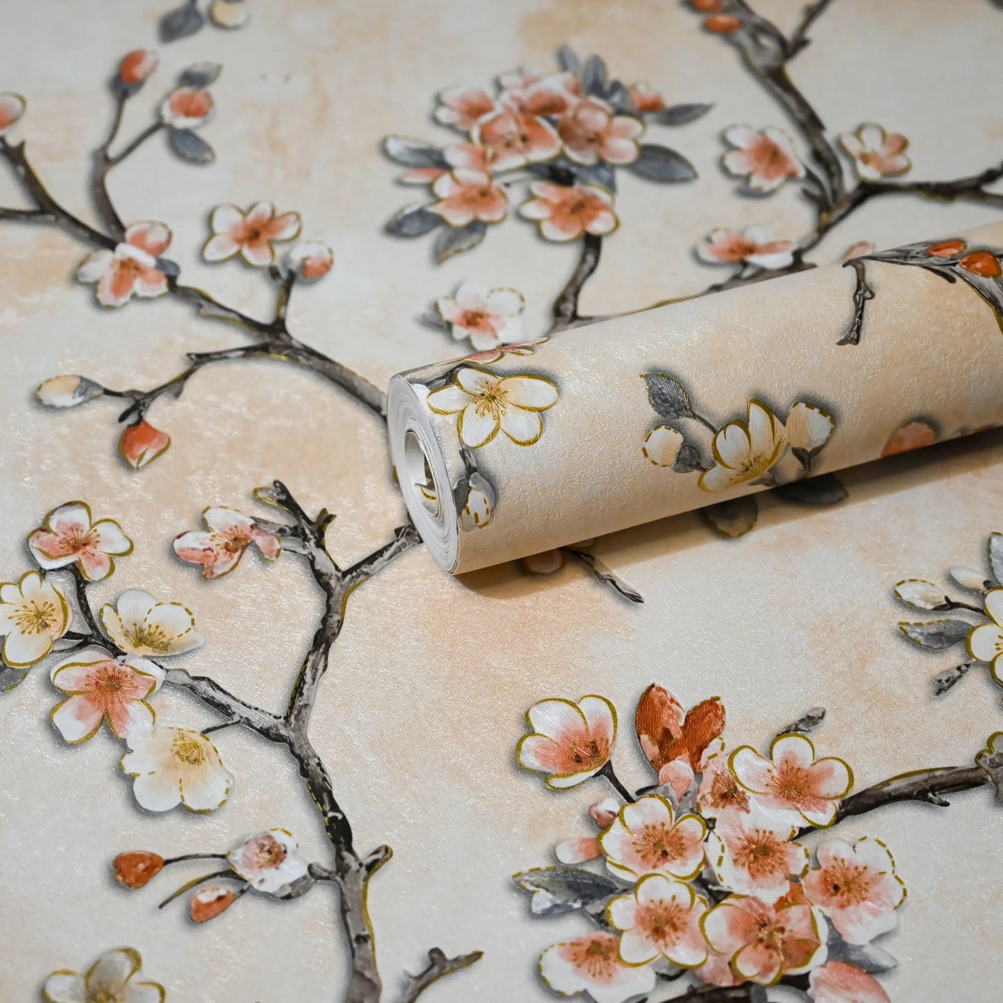 Roll of wallpaper with cherry blossom design on a beige background