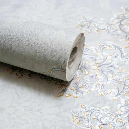 Roll of embossed wallpaper with intricate design on a plain background