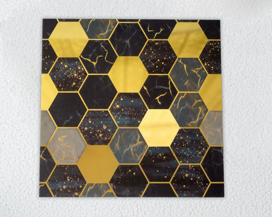 Hexagonal pattern with gold and black colors on a textured white background