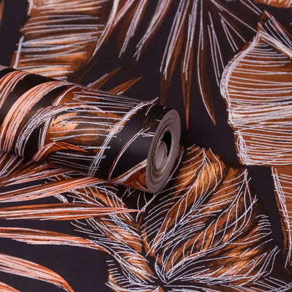 Roll of wallpaper with leaf pattern on a dark background