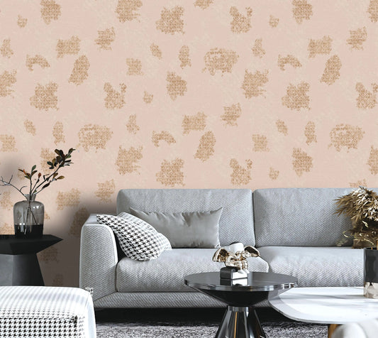 Living room with a gray sofa, decorative pillows, and a patterned wall.