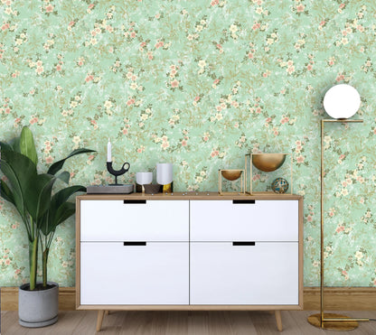 White dresser with decorative items against a floral wallpapered wall