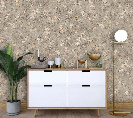 White dresser with decorative items against a floral wallpapered wall