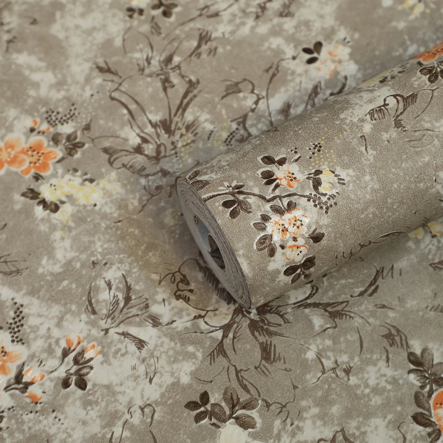 Roll of floral-patterned fabric with a beige background