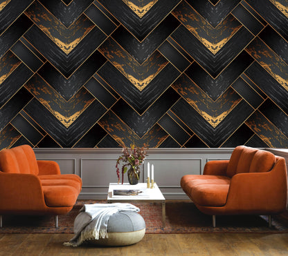 Modern living room with orange chairs and a decorative wall.