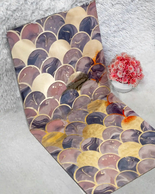 Yoga mat with a colorful scale pattern on a textured surface