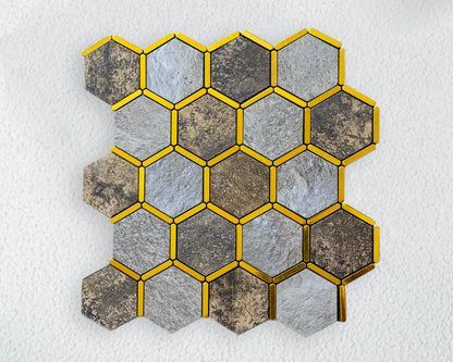 Hexagonal tiles with gold borders on a textured white background