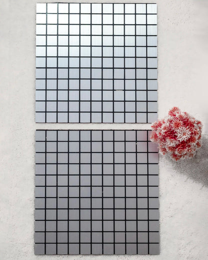Two rectangular tiles with grid patterns on a light gray background