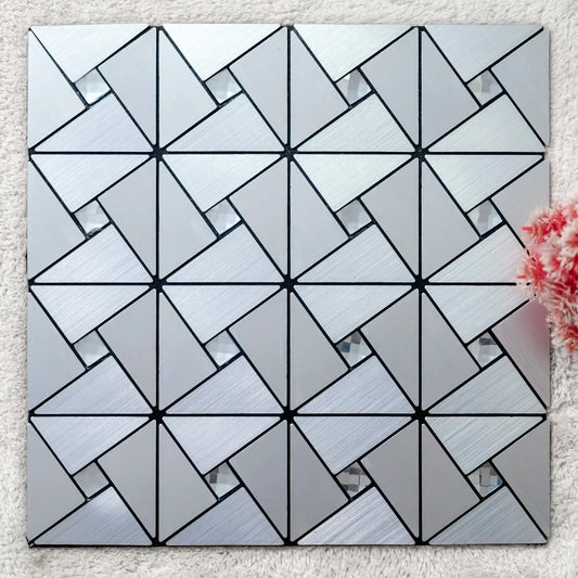 Geometric patterned tile on a textured surface with a floral arrangement.