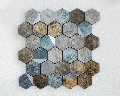 Hexagonal mosaic tile sample with various shades of gray and brown on a white background