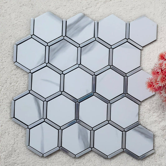 Hexagonal mirror tiles with metallic border on a textured surface