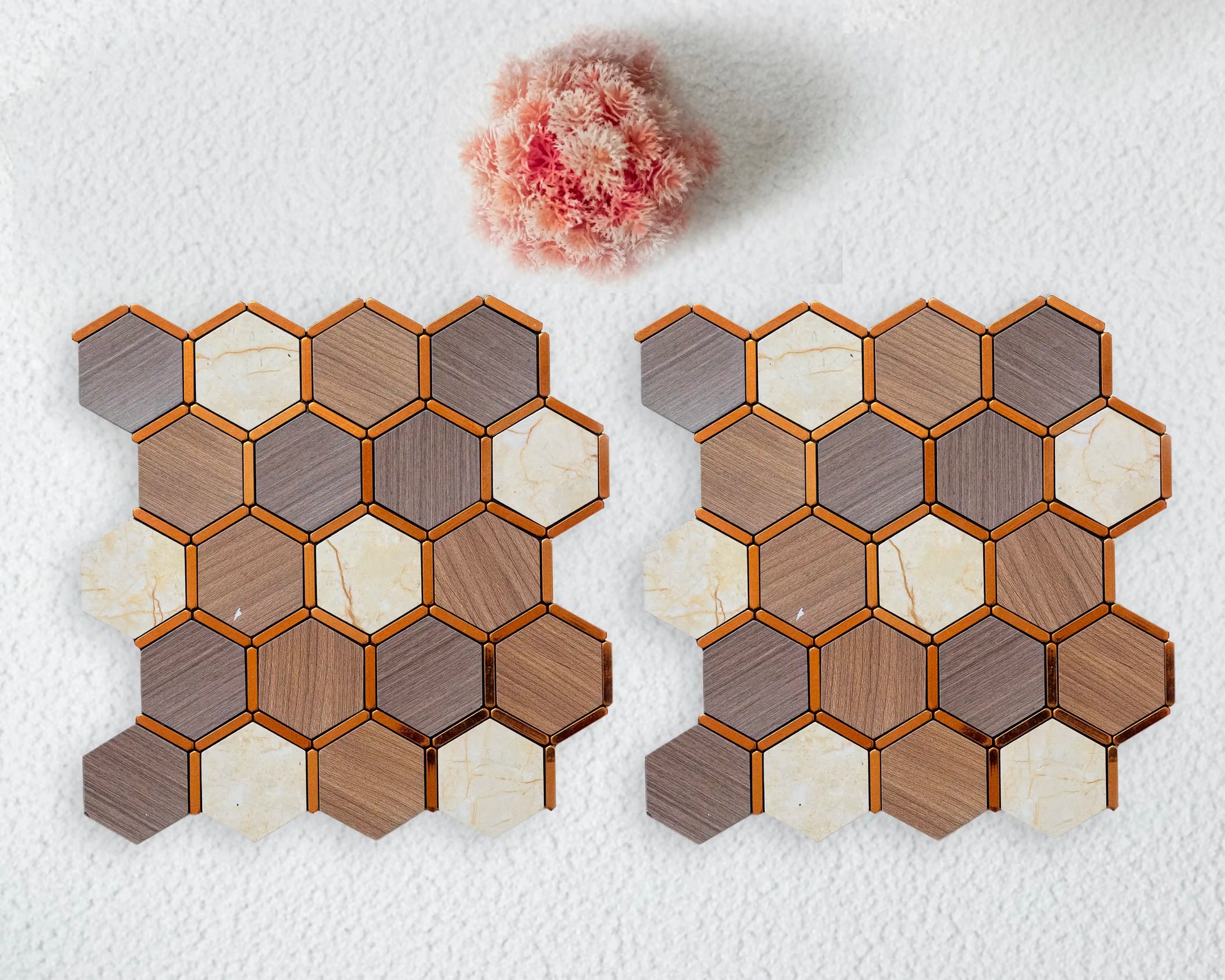 Hexagonal tile samples in various colors on a textured white surface.