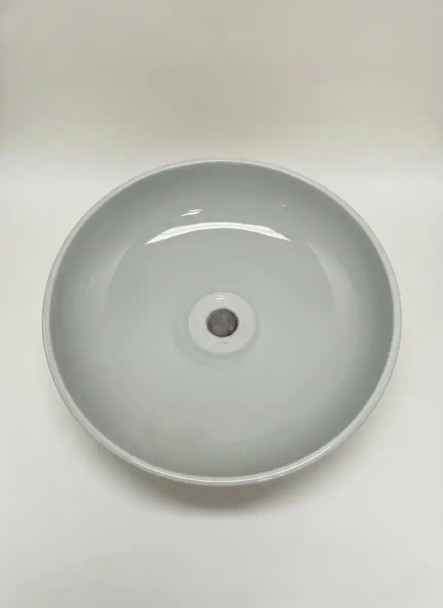 Gray ceramic sink basin on a white background