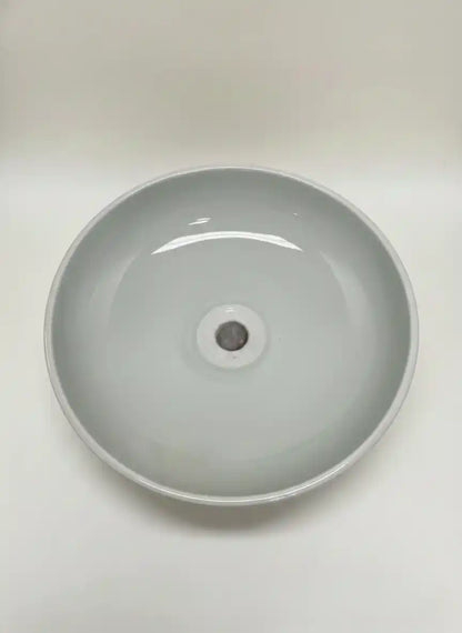 Gray ceramic sink basin on a white background