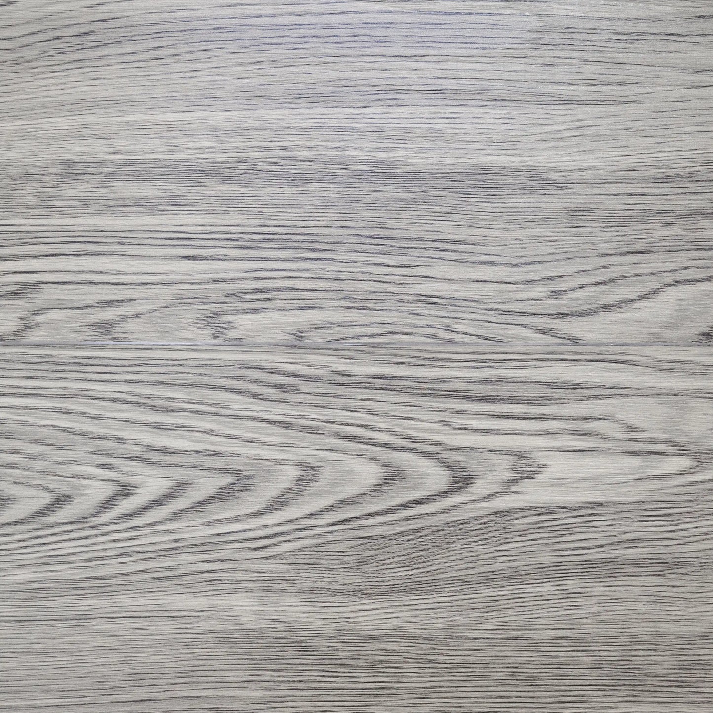 Close-up of a gray wooden surface with visible grain patterns
