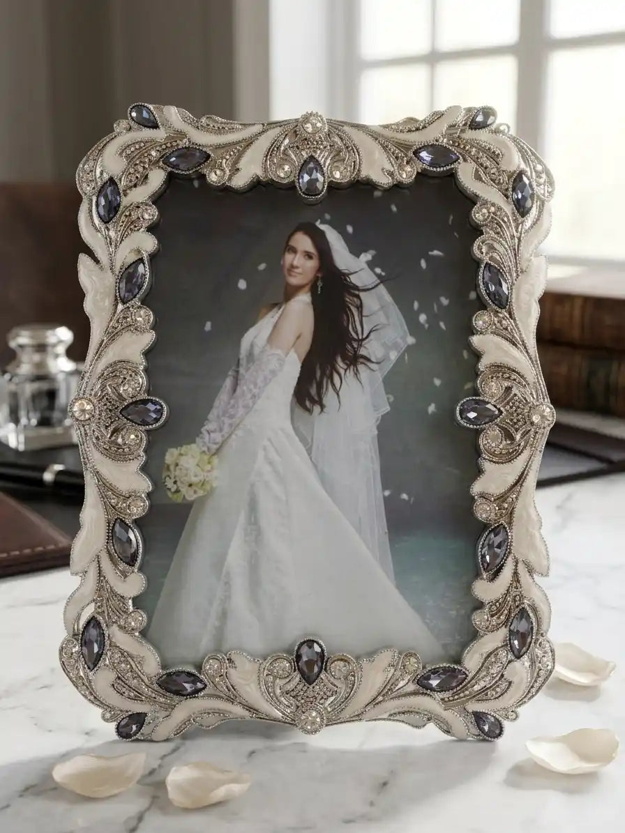Decorative photo frame with a bride in a wedding dress on a marble surface.