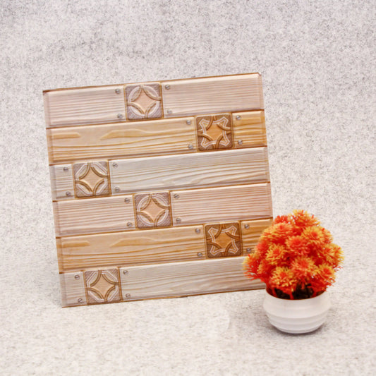 Wooden decorative panel with geometric patterns next to a potted plant on a textured surface