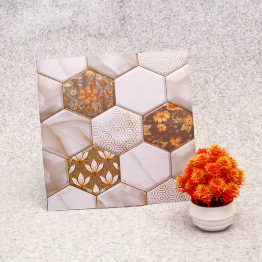 Hexagonal tile pattern with floral designs on a textured surface next to a potted plant.