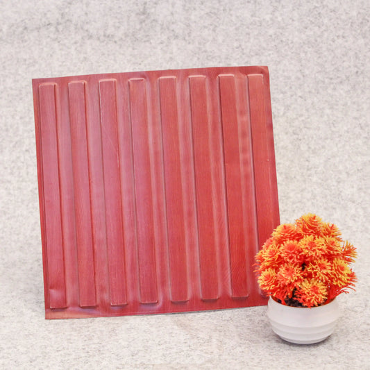 Red decorative panel with vertical slats on a textured surface next to a potted plant.