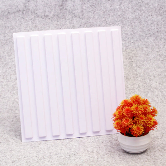 White radiator and potted plant with orange flowers on a gray surface