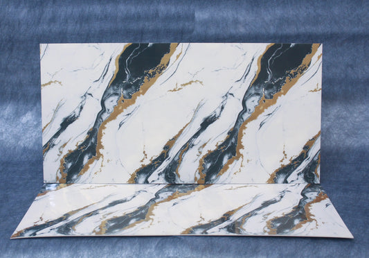 Marble-patterned paper on a textured blue background