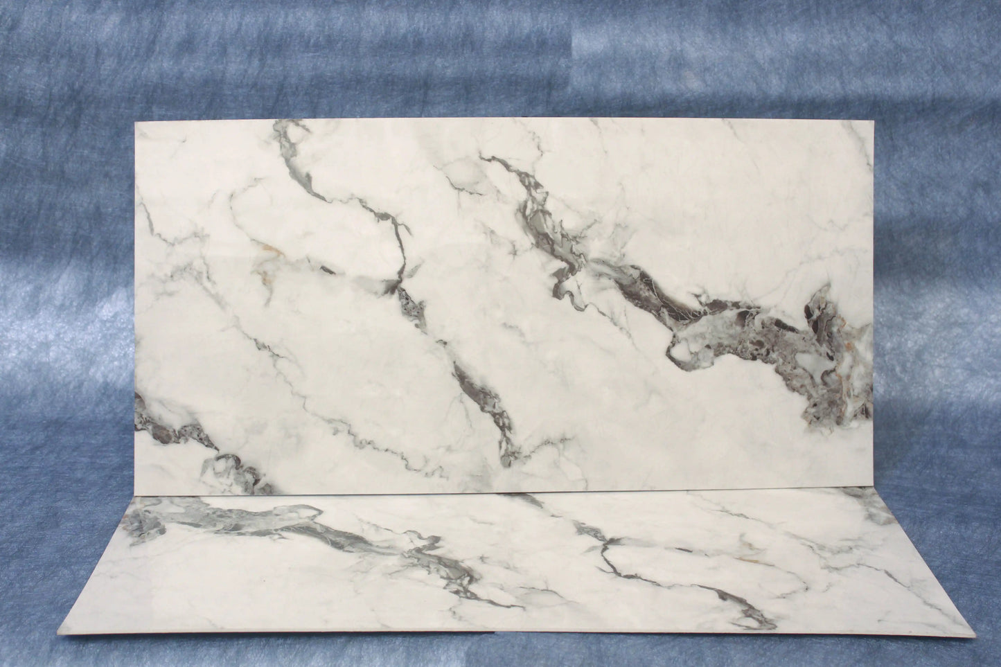 Marble-patterned paper on a textured blue background
