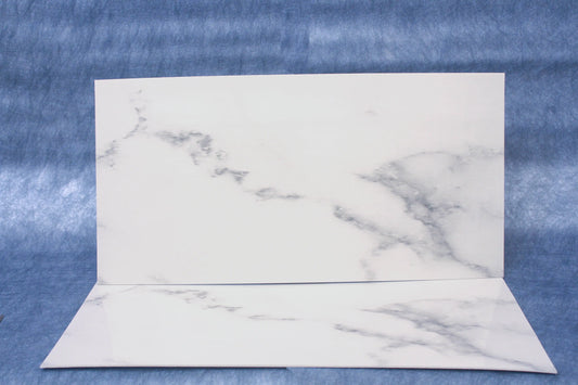 Marble-patterned paper on a blue textured background