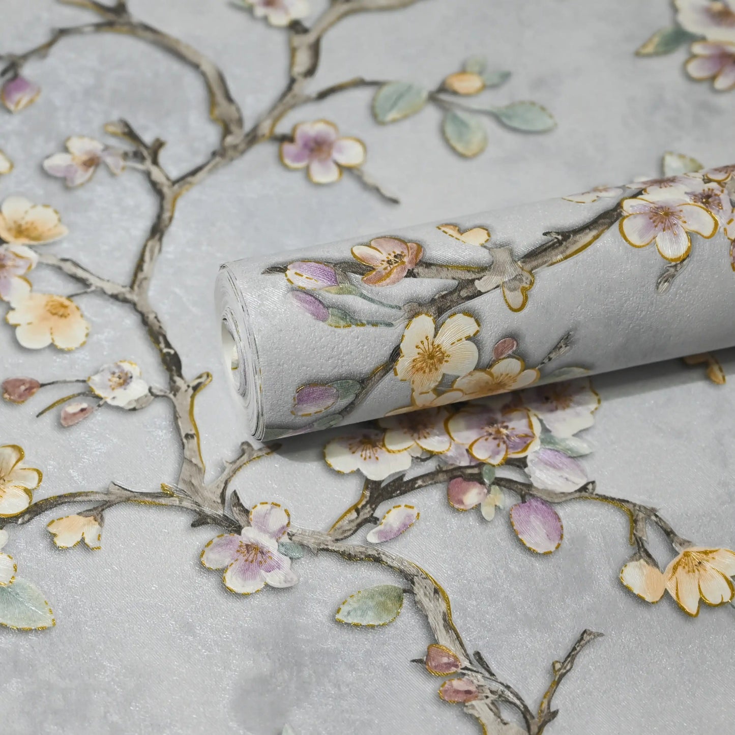 Roll of wallpaper with floral design on a light gray background
