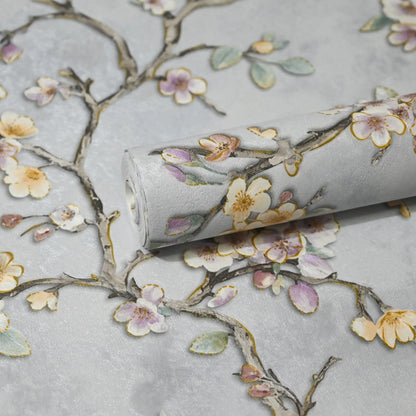Roll of wallpaper with floral design on a light gray background