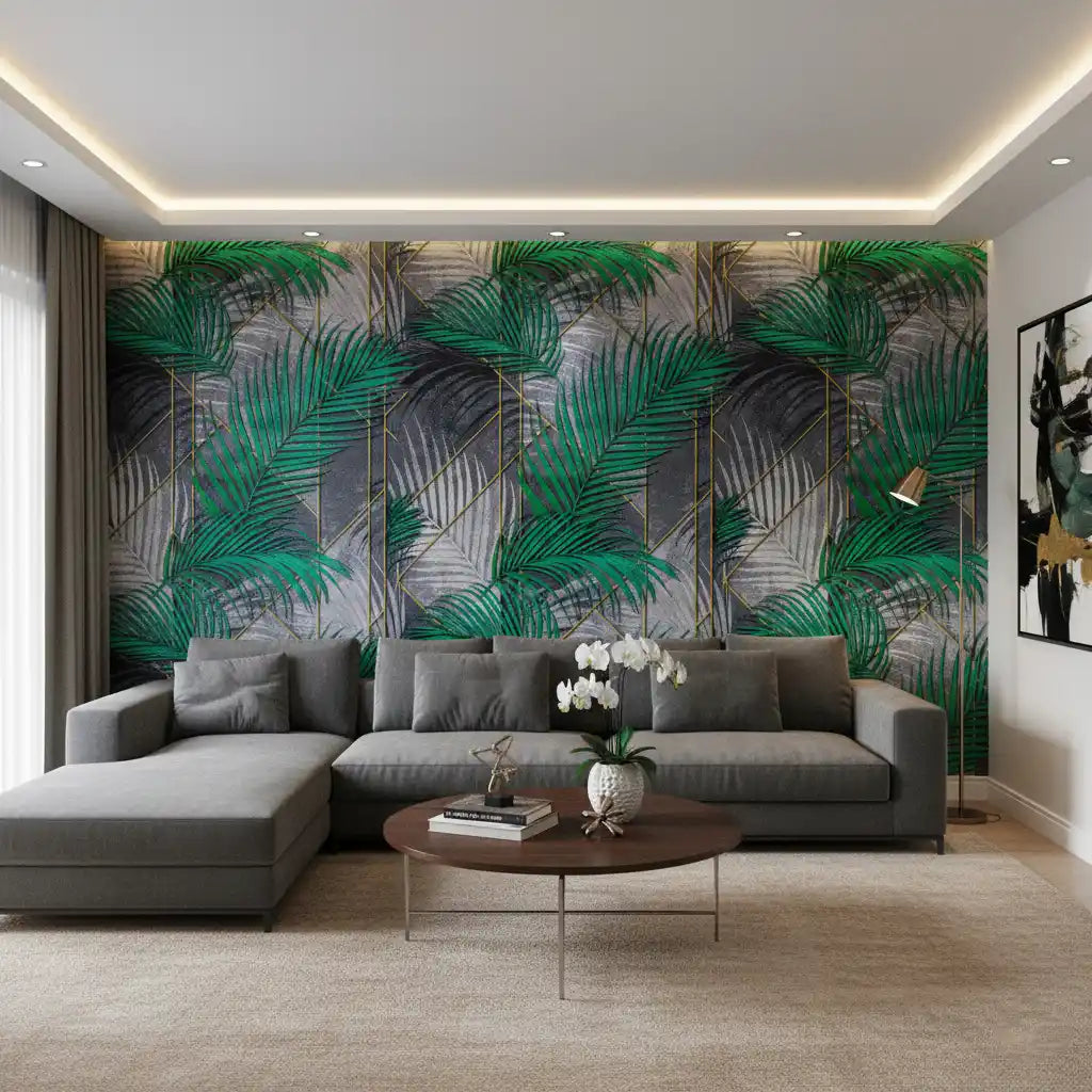 Modern living room with a gray sectional sofa, round wooden coffee table, and tropical leaf wall design.