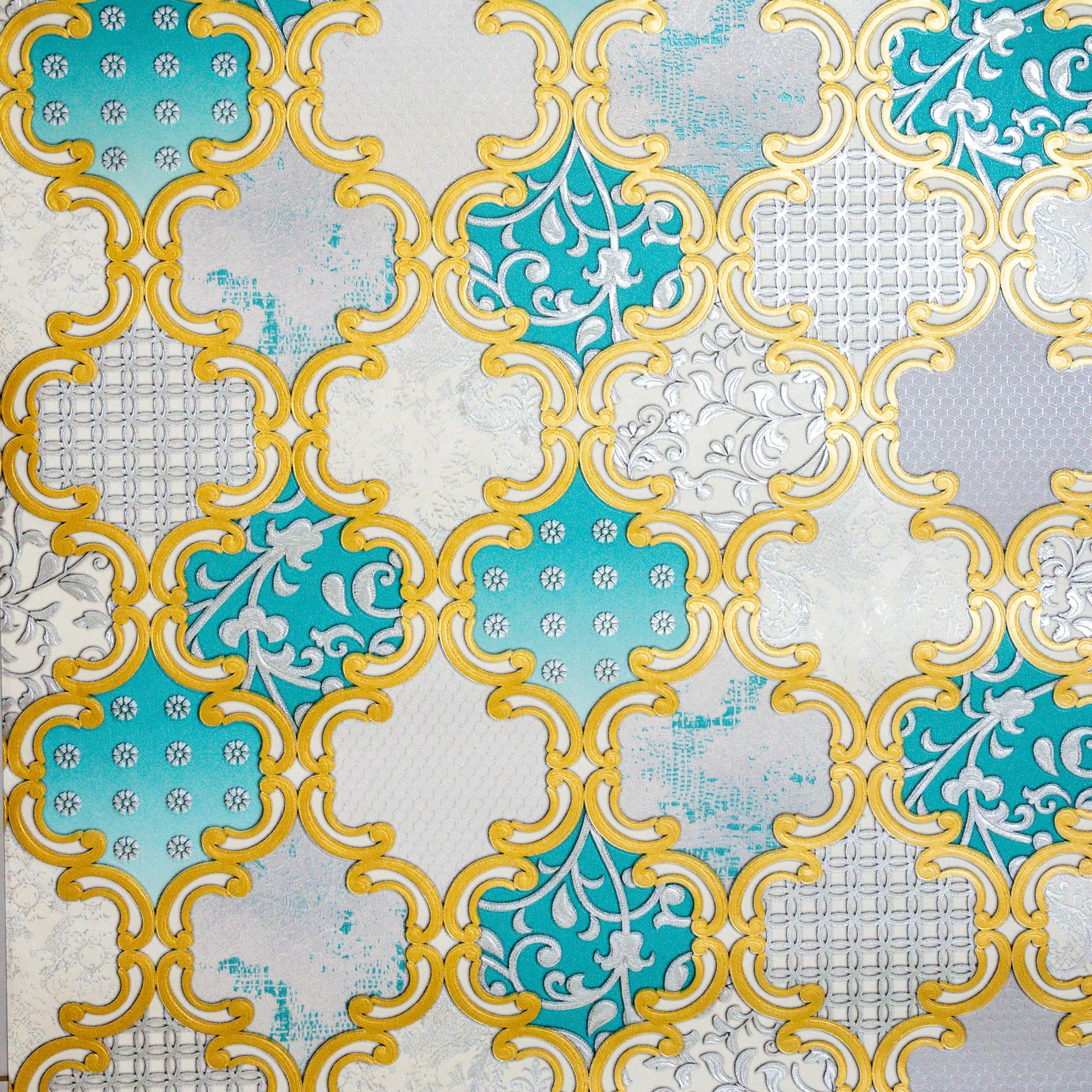 Decorative tiles with turquoise, yellow, and white pattern on a textured background