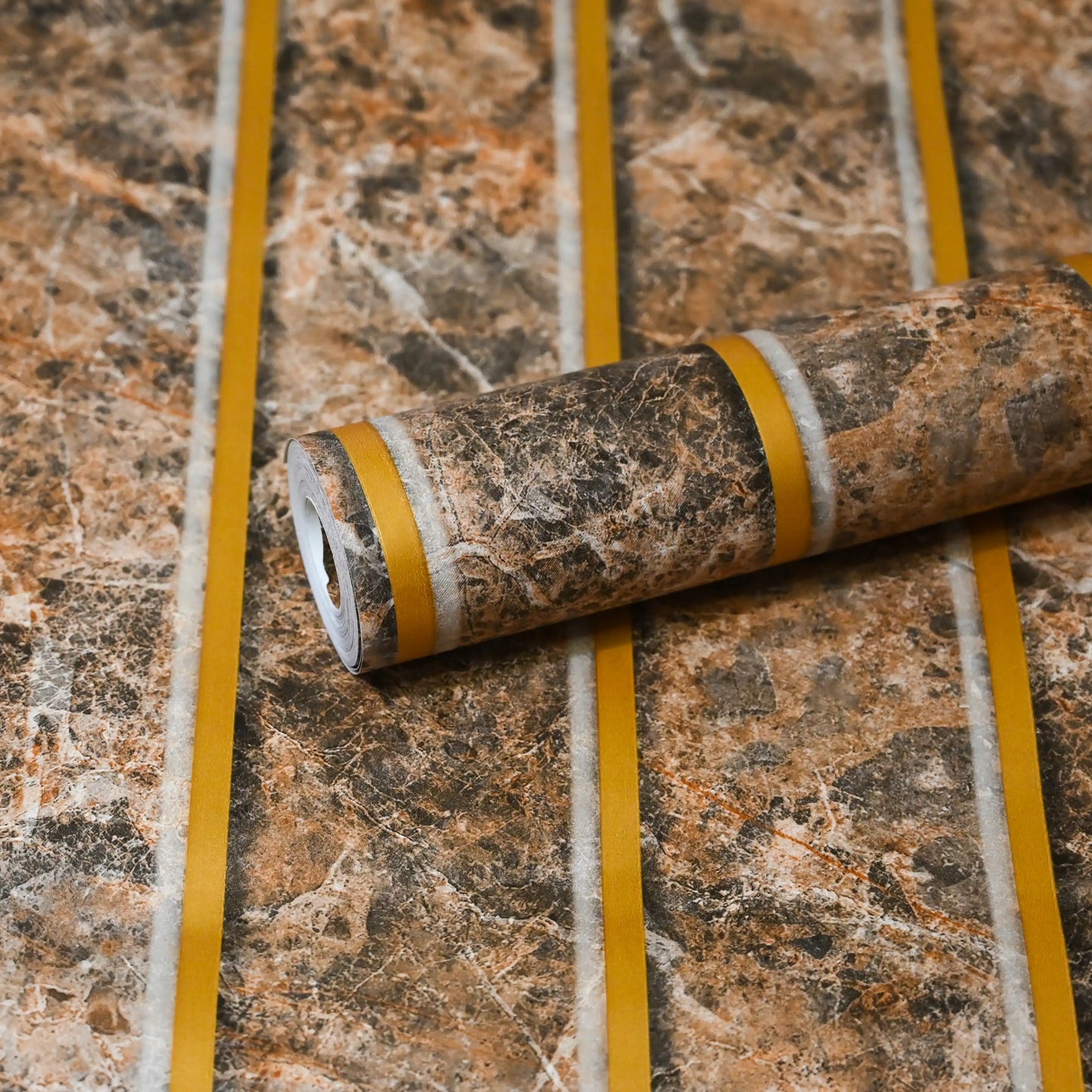Roll of brown marble-patterned vinyl flooring on a matching floor.