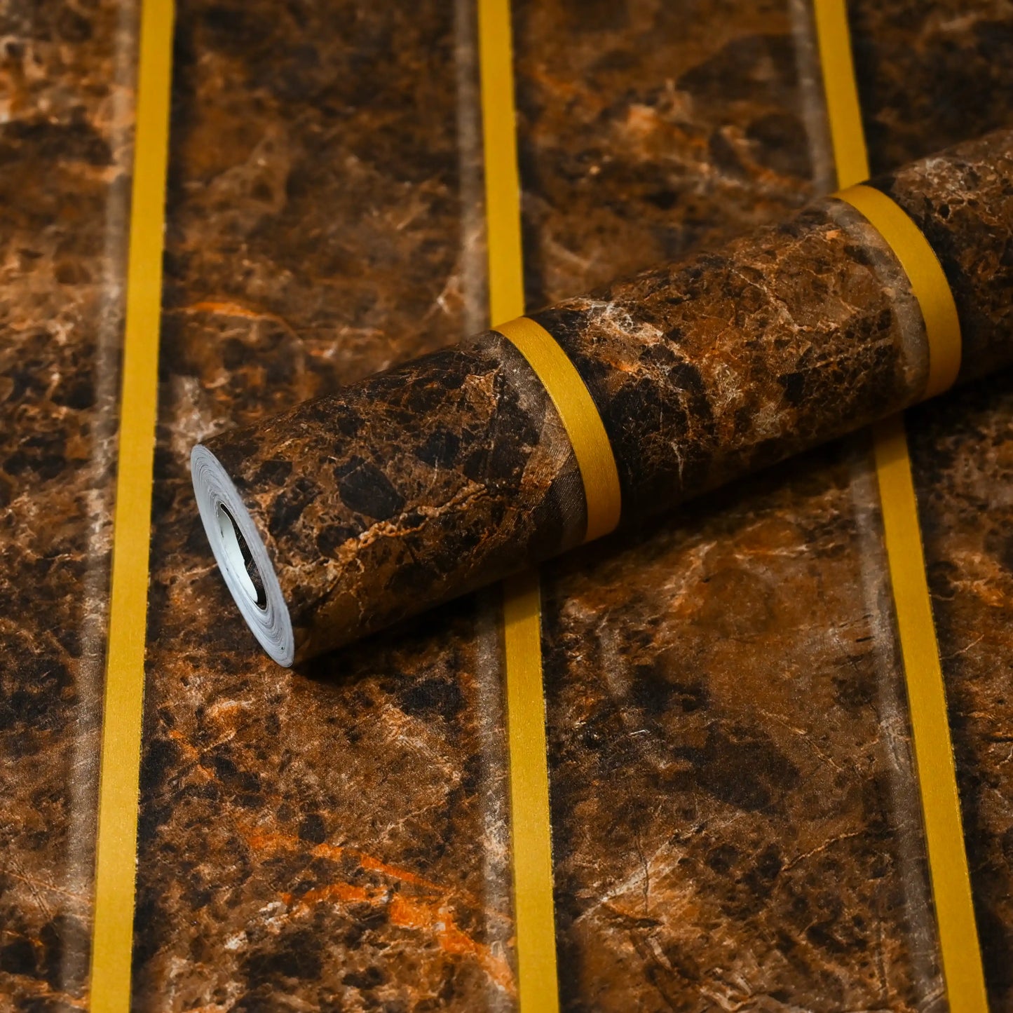 Marble-patterned roll of paper with yellow tape on a matching background