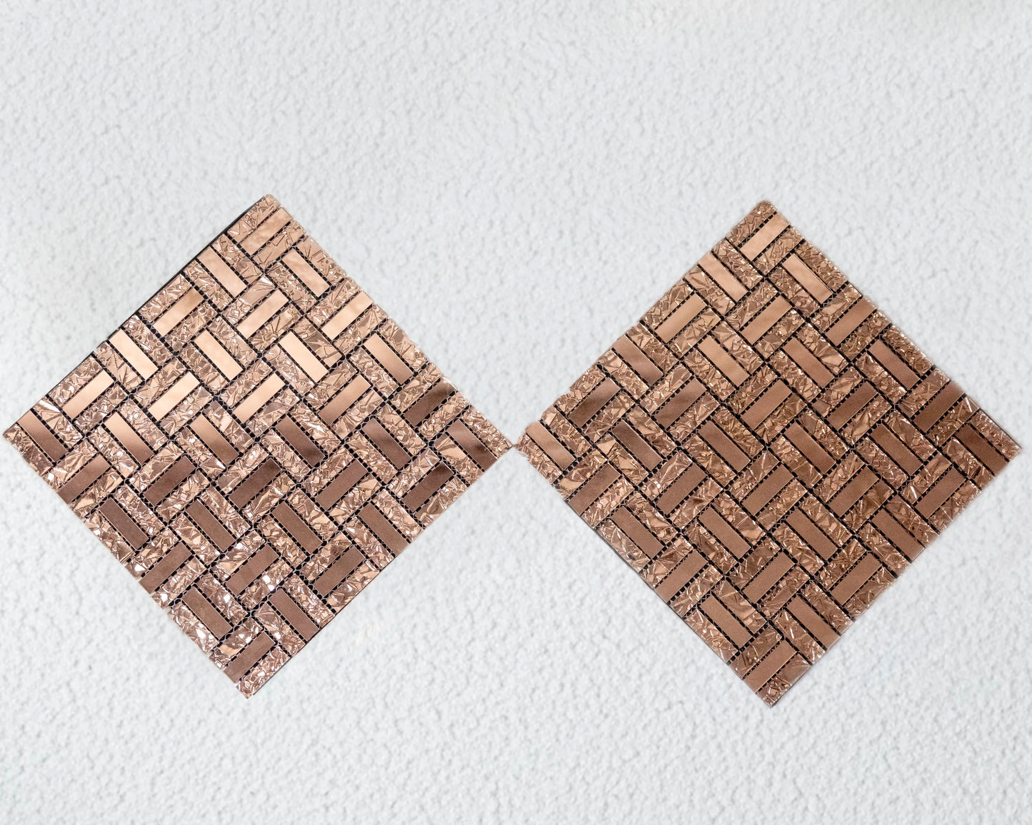 Two woven wooden coasters on a textured white surface