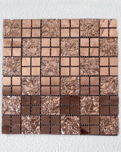 Mosaic tile sample with brown and silver squares on a white background