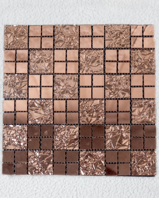 Mosaic tile sample with brown and silver squares on a white background