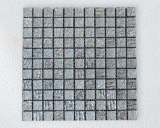 Square mosaic tile with a grid pattern on a light gray background