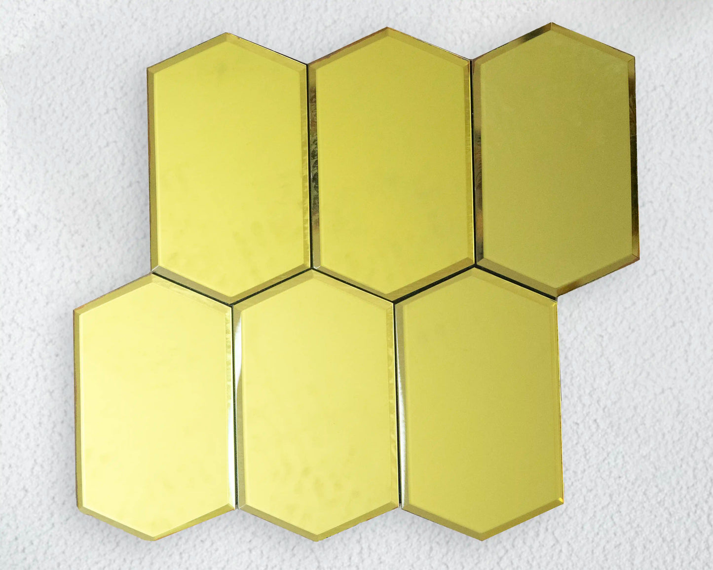 Hexagonal gold tiles on a white background