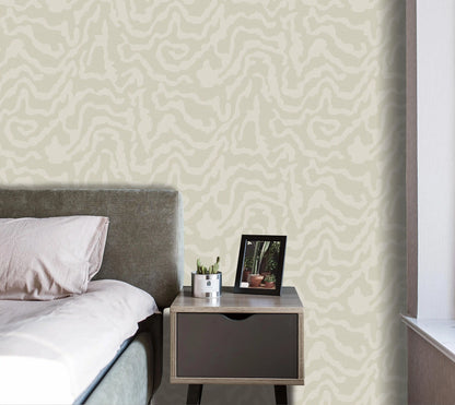 Bedroom with a bed and nightstand against a patterned wall.