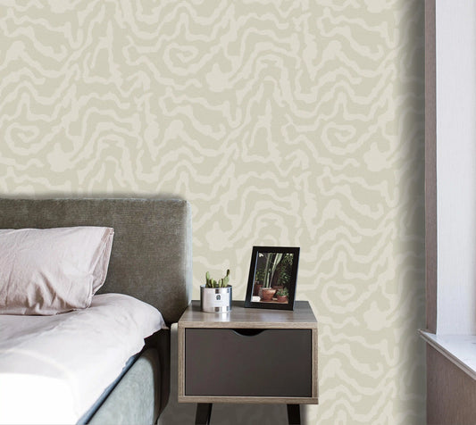 Bedroom with a bed and nightstand against a patterned wall.