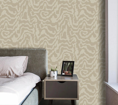 Bedroom with patterned wallpaper, bed, and nightstand.