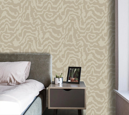 Bedroom with patterned wallpaper, bed, and nightstand.