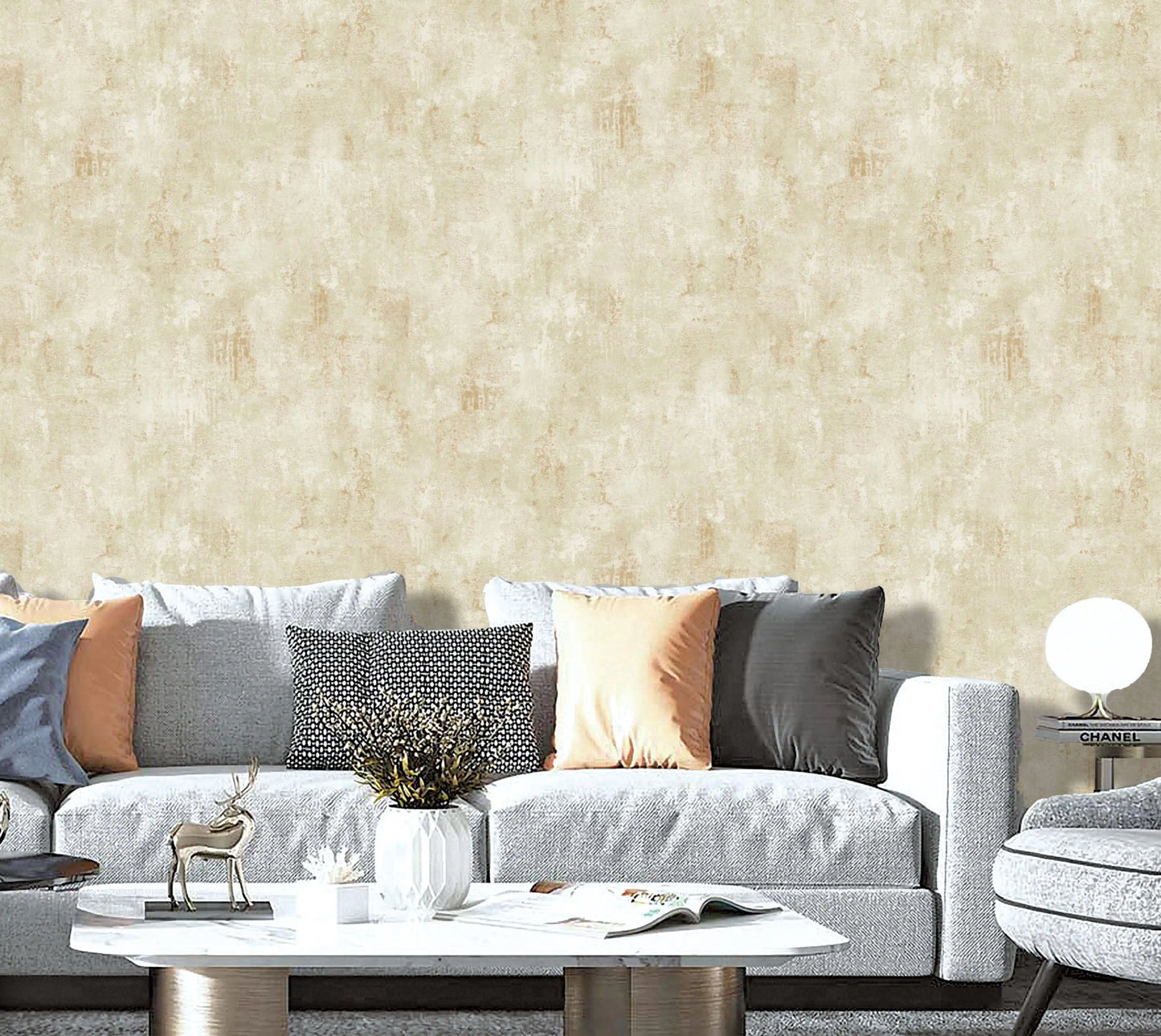 Living room with a gray sofa, decorative pillows, and a textured beige wall.