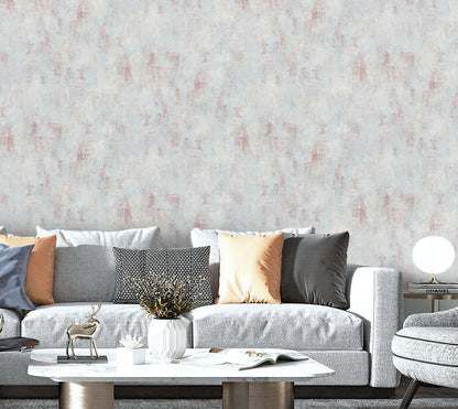Living room with a gray sofa, decorative pillows, and a textured wall.