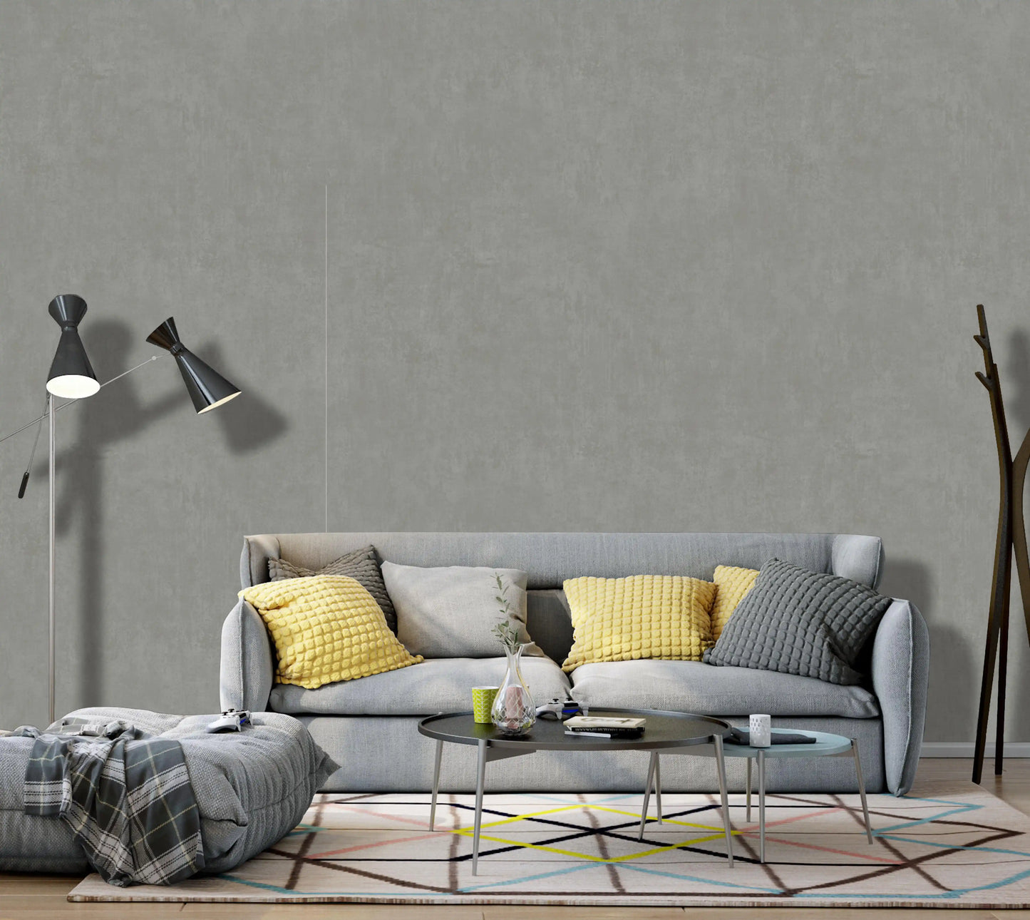 Modern living room with a gray sofa, yellow cushions, and decorative items.