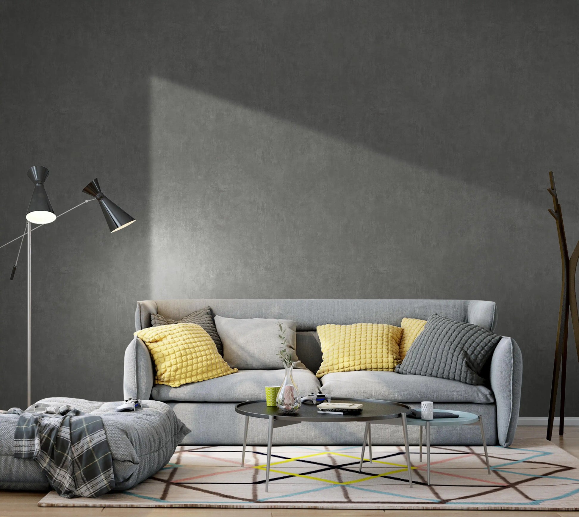 Modern living room with a gray sofa, yellow cushions, and a dark gray wall.