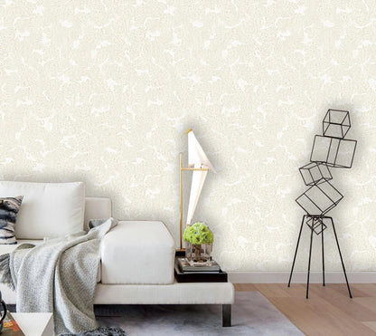 Modern bedroom with a bed, nightstand, and decorative lamp against a patterned wall.