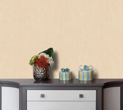 Decorative items on a table against a beige wall